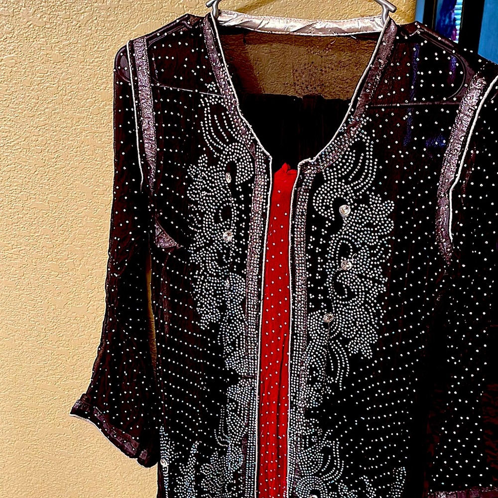 This is an Asian dress with long sleeves